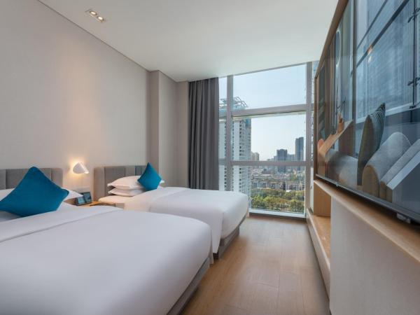 Pagoda Hotel Shenzhen : photo 1 de la chambre chambre lits jumeaux deluxe