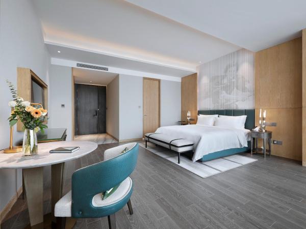 Qingdao Oriental Studio Chuangzhi SSAW Hotel : photo 2 de la chambre chambre d'affaires exécutive avec lit king-size 