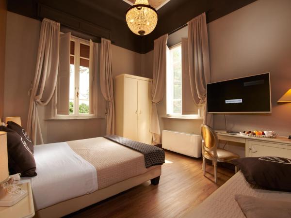 Villa Tower Inn : photo 1 de la chambre chambre triple familiale