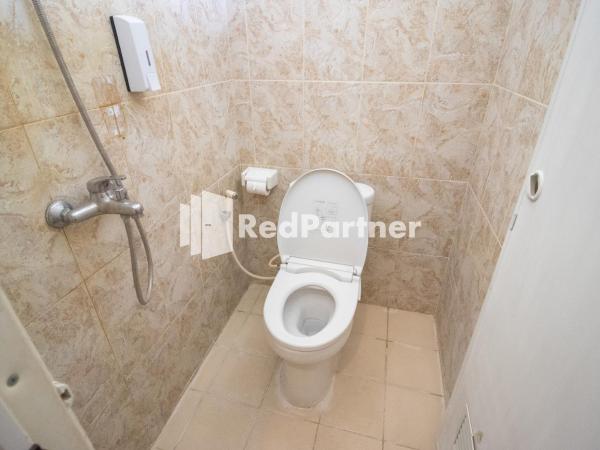 Griya Damai Syariah Yogyakarta Mitra RedDoorz : photo 6 de la chambre chambre lits jumeaux