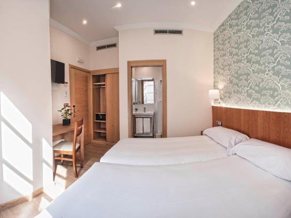 Pensión O Códice : photo 2 de la chambre chambre lits jumeaux