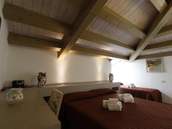 Hotel Villa Fanusa : photo 1 de la chambre chambre quadruple