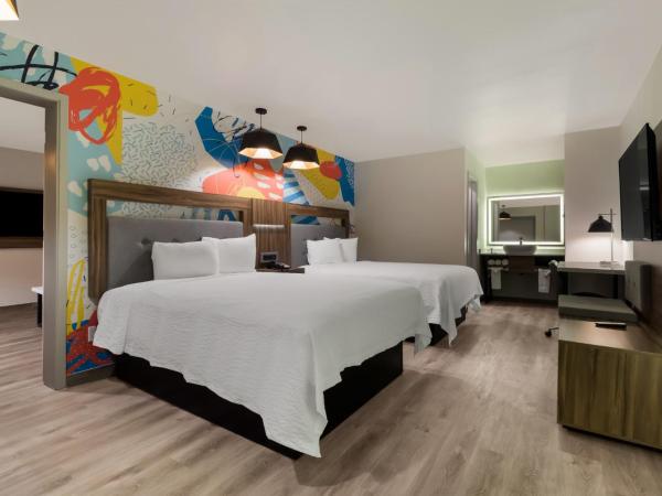 Signature Inn Houston Galleria : photo 1 de la chambre suite lit queen-size
