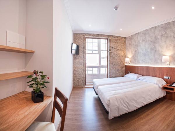 Pensión O Códice : photo 1 de la chambre chambre lits jumeaux supérieure