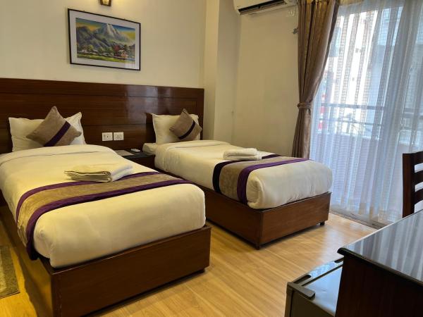 Hotel New Era : photo 2 de la chambre chambre lits jumeaux deluxe