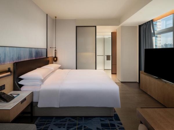 Guangzhou Marriott Hotel Nansha : photo 2 de la chambre chambre lit king-size deluxe - vue sur jardin