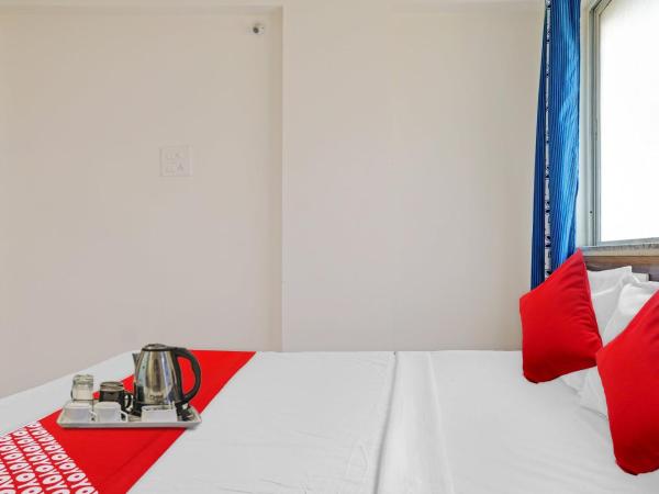 SPOT ON Swarg Executive Paradise Near Fun Time Multiplex : photo 7 de la chambre chambre triple classique