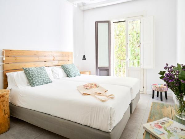 Eco Boutique Hostal Grau : photo 1 de la chambre studio familial avec kitchenette