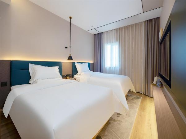 Chaoman Hotel -Guangzhou Shijing City Plaza Xiaoping Subway Station : photo 1 de la chambre chambre lits jumeaux deluxe