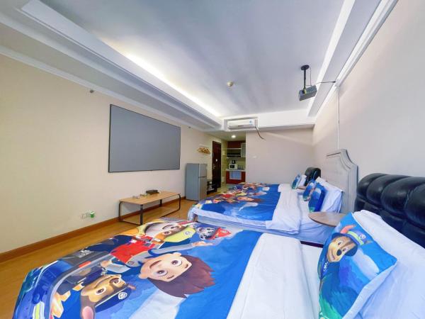 Youlejia Projection Apartment Guangzhou Beijing Road Pedestrian Street Branch : photo 3 de la chambre chambre lit king-size ou lits jumeaux supérieure