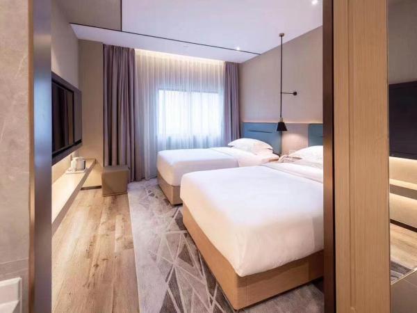 Chaoman Hotel -Guangzhou Shijing City Plaza Xiaoping Subway Station : photo 2 de la chambre chambre lits jumeaux deluxe