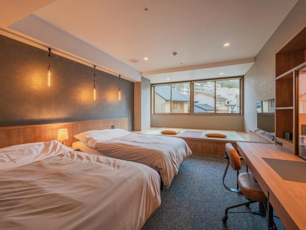 HOTEL ALGO : photo 2 de la chambre chambre lits jumeaux supérieure - vue sur ville