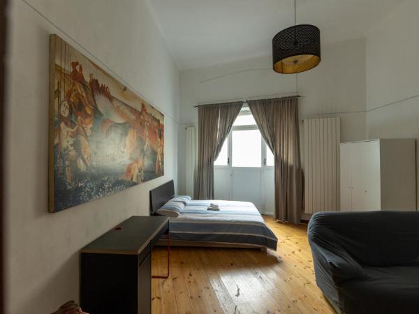 camera monolocale : photo 1 de la chambre grande chambre double