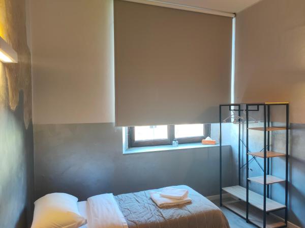 Apartment Nido Stazione : photo 1 de la chambre chambre lits jumeaux avec salle de bains privative séparée