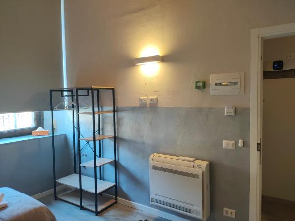 Apartment Nido Stazione : photo 6 de la chambre chambre lits jumeaux avec salle de bains privative séparée