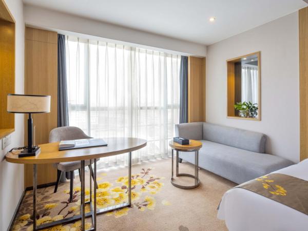 United Kingson HoteL : photo 1 de la chambre chambre lit king-size exécutive