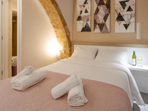 Mitos mini suites : photo 2 de la chambre chambre triple avec salle de bains privative