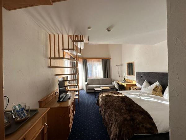 Hotel Bünda Davos : photo 5 de la chambre chambre familiale avec balcon