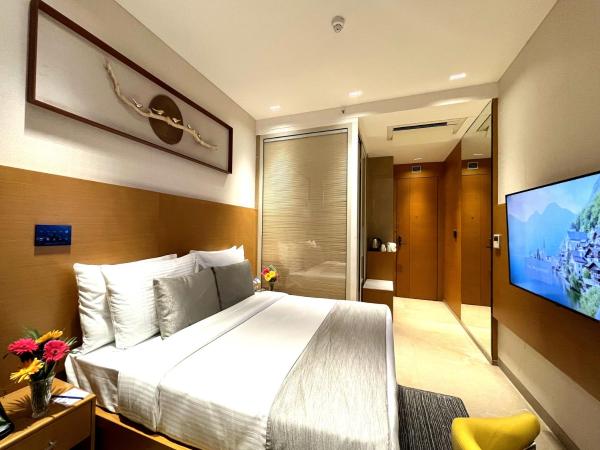 Morvee Hotels Alipore Kolkata : photo 7 de la chambre chambre supérieure lit queen-size