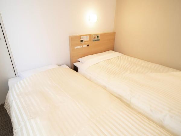 Super Hotel Asakusa : photo 2 de la chambre chambre lits jumeaux communicante - non-fumeurs