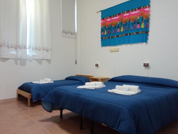 Beteyà Hostel Don Bosco : photo 1 de la chambre chambre triple - accessible aux personnes à mobilité réduite