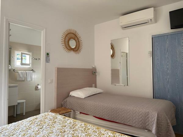 Hotel Punta e Mare des Chambres ou Appartements T2 : photo 3 de la chambre chambre triple - vue sur jardin