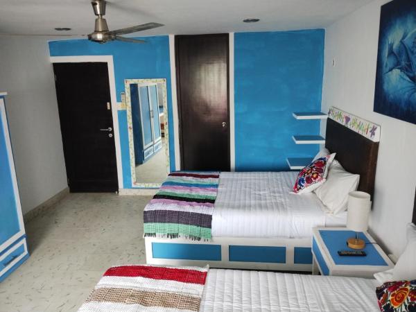 T´úubul K´iin Bed & Breakfast : photo 2 de la chambre chambre lits jumeaux