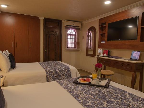 Arcángel Puebla : photo 4 de la chambre chambre double avec 2 lits doubles