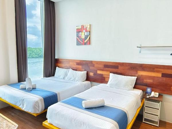 The Riverbank Hotel By MRVJ Business : photo 2 de la chambre suite familiale