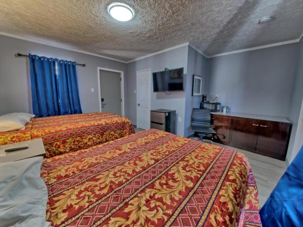 Aqua View Motel : photo 2 de la chambre chambre quadruple standard avec 2 lits doubles - non-fumeurs