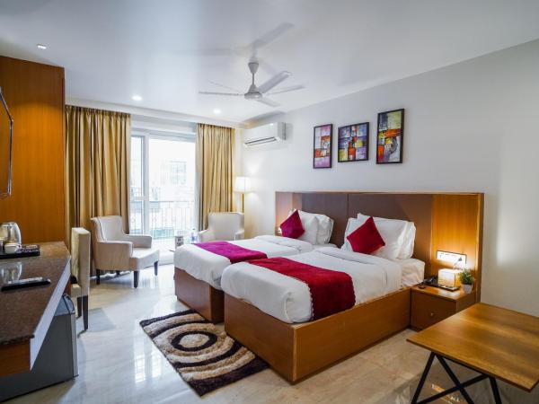 Saltstayz Executive Studio Apartment : photo 2 de la chambre chambre lits jumeaux avec balcon