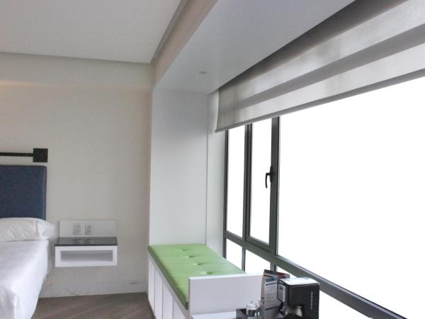 WeEnjoy Hotels Grand Prix Aeropuerto CDMX : photo 4 de la chambre chambre double avec 2 lits doubles