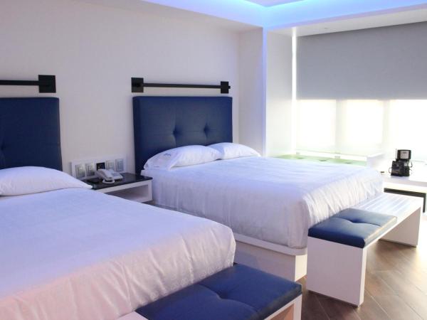 WeEnjoy Hotels Grand Prix Aeropuerto CDMX : photo 1 de la chambre chambre triple