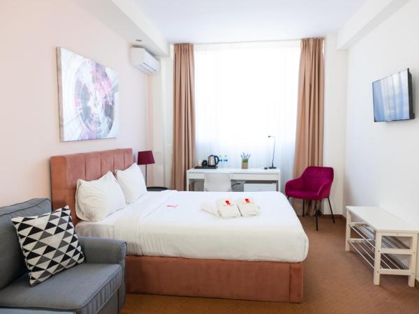 City Plaza Apartments & Rooms : photo 1 de la chambre chambre deluxe