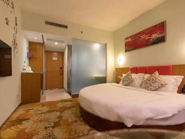 Shanshui Trends Hotel - Huaqiangbei : photo 1 de la chambre chambre romantique avec lit rond