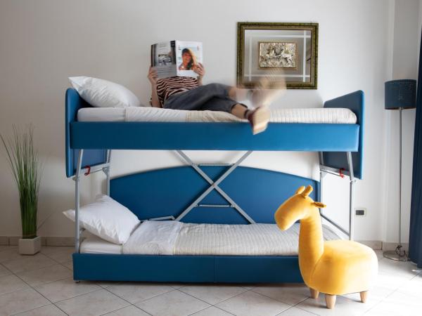 Casa Merano Residence & Ristorante Bibione Centro : photo 4 de la chambre suite familiale avec balcon