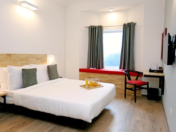 OYO Townhouse 17 Huda City Center Near Leisure Valley Park : photo 3 de la chambre chambre triple classique