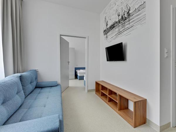 Apartgdynia : photo 10 de la chambre chambre quadruple