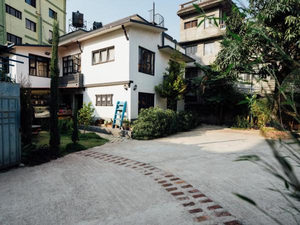 Omana Hotel : photo 4 de la chambre chambre lit king-size - vue sur jardin