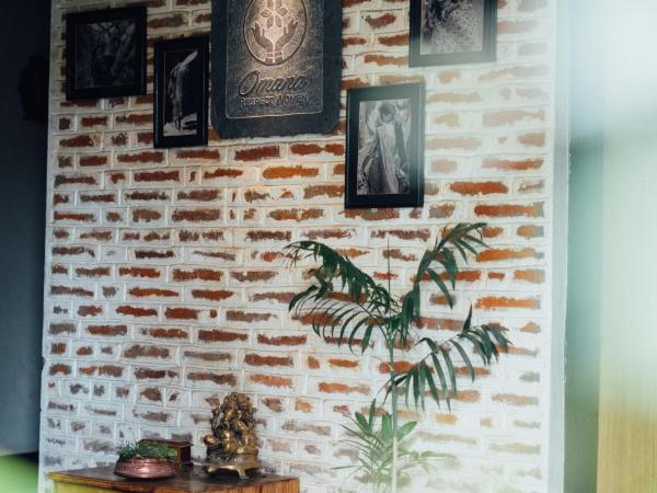 Omana Hotel : photo 5 de la chambre chambre lit king-size - vue sur jardin