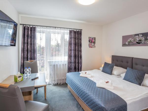 Elendris - Ubytování u kostela : photo 6 de la chambre chambre deluxe double ou lits jumeaux