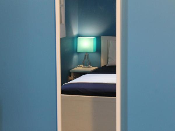 B&B Le Saline : photo 2 de la chambre chambre quadruple avec salle de bains