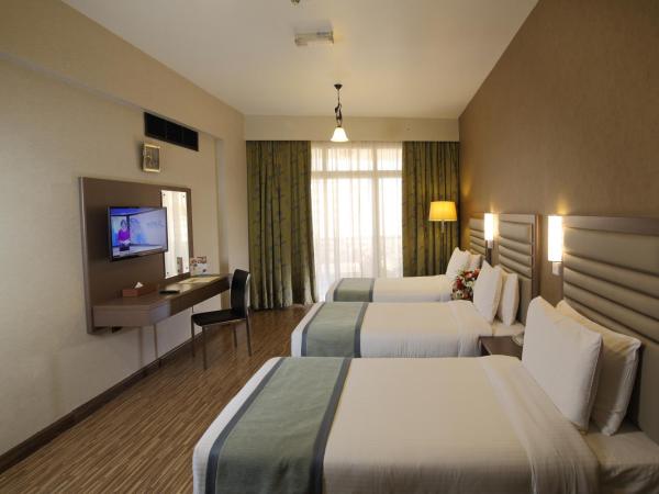 Wave International Hotel : photo 2 de la chambre chambre triple standard