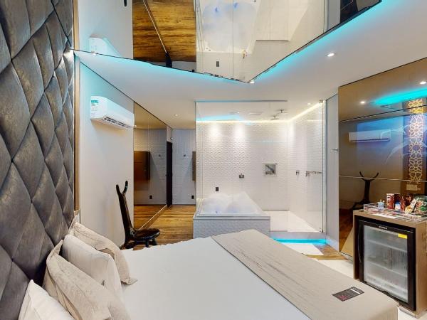 Motel DUBAI BH : photo 7 de la chambre suite lit king-size avec baignoire spa