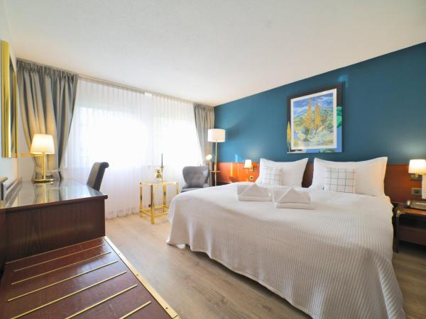 Tulip Inn Beaulieu Lausanne : photo 1 de la chambre chambre supérieure avec lit king-size