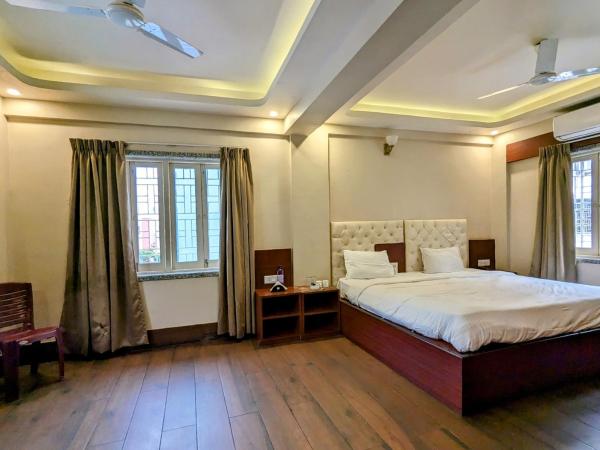 The Aster Enclave Hotel : photo 1 de la chambre suite lit king-size