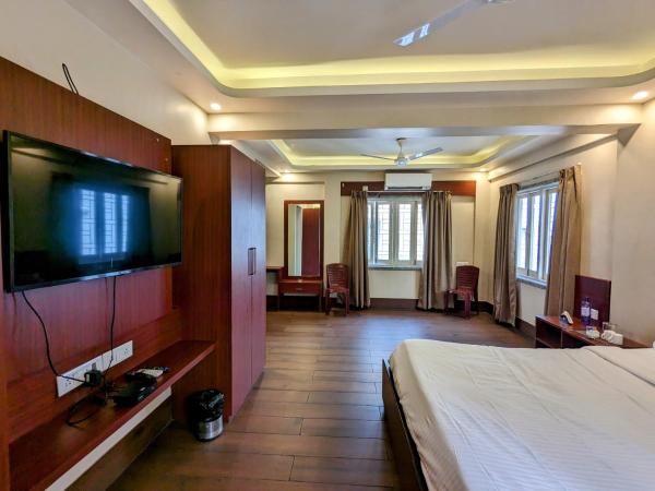 The Aster Enclave Hotel : photo 4 de la chambre suite lit king-size