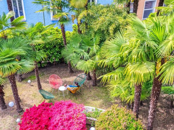 Villa by @ Home Hotel Locarno : photo 9 de la chambre suite de luxe avec balcon