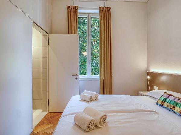 Villa by @ Home Hotel Locarno : photo 4 de la chambre chambre supérieure lit queen-size