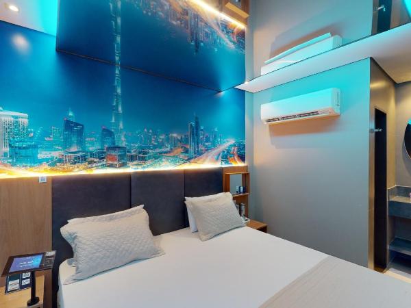 Motel DUBAI BH : photo 4 de la chambre suite avec piscine privée